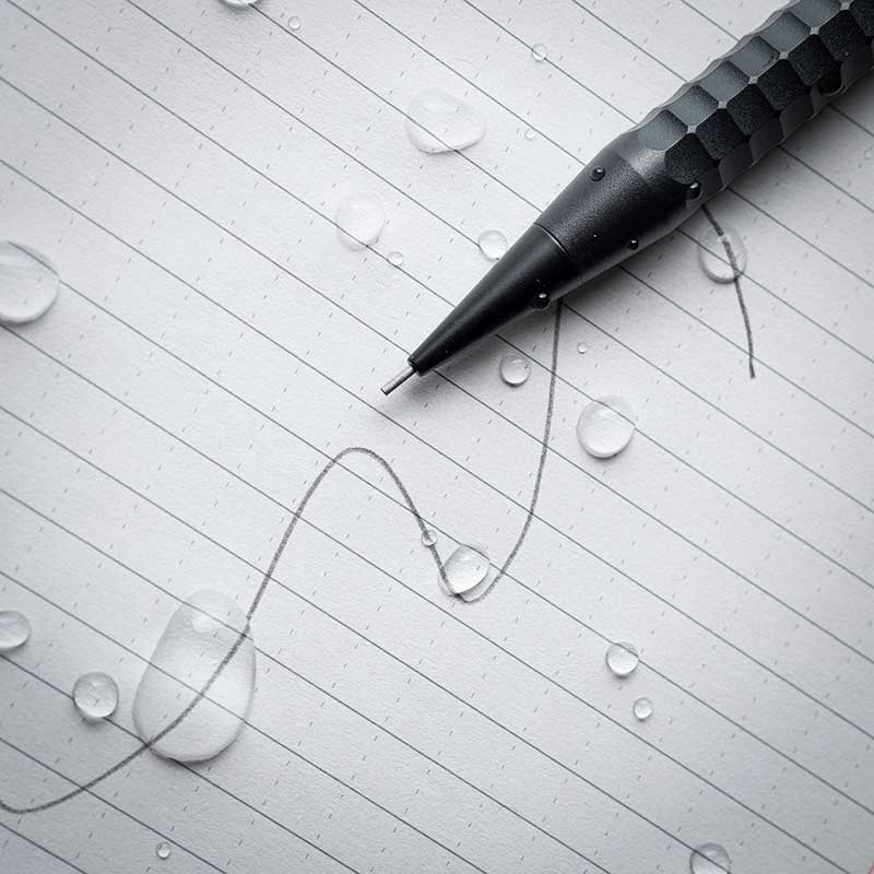 pencil sitting on paper with handwritten chart